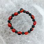 Load image into Gallery viewer, Lava Rock and Male Huayruro Bracelet 11mm
