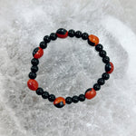 Load image into Gallery viewer, Onyx and Male Huayruro Bracelet 11mm
