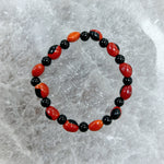 Load image into Gallery viewer, Onyx and Male Huayruro Bracelet 11mm
