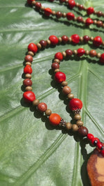 Load and play video in Gallery viewer, Sacred Ayahuasca with Sandalwood and Female Huayruro Seeds - Long Necklace
